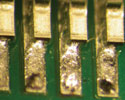 Figure 3. Flux exhaustion during reflow leaving incomplete coalescence of solder balls. This can occur with some combinations of paste and convection profiles in air